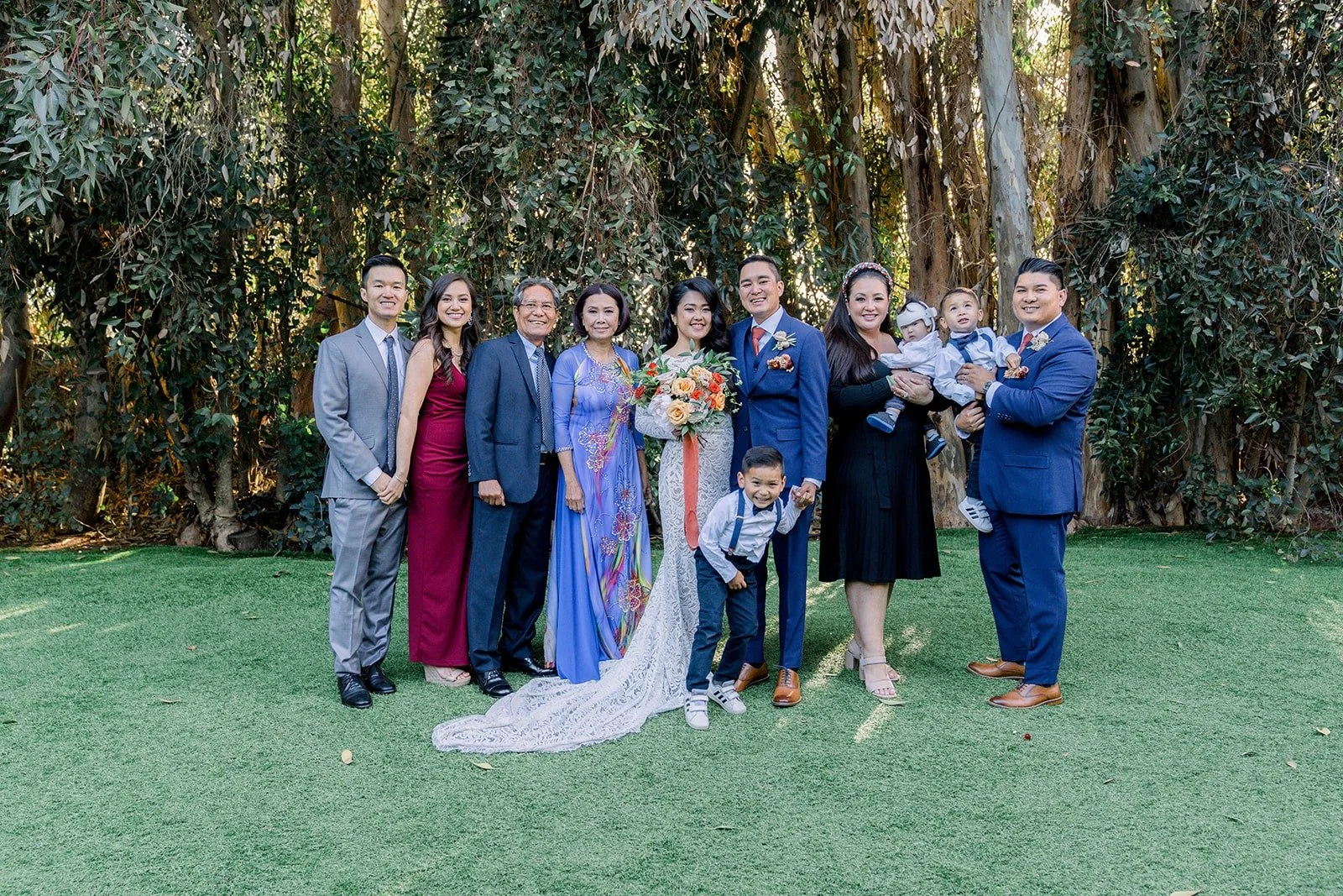 Hannah and Vincent with their families on the lawn