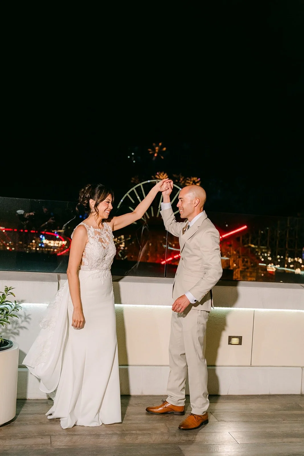 Francesca and Daniel dance on the Jewel Terrace at night
