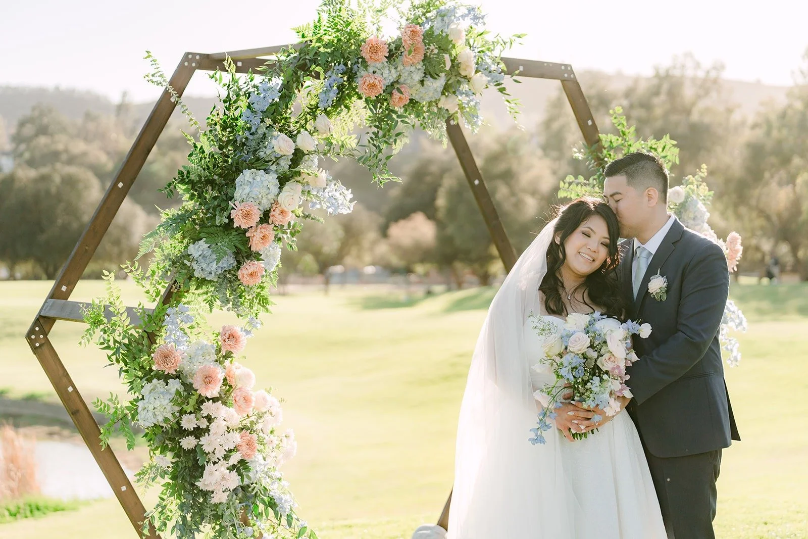 Florence and Jordan under the hexagon arch on the 15th hole