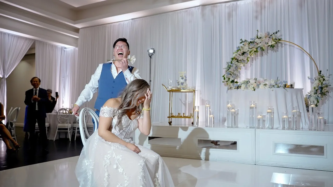 Video still of the garter toss on the dance floor at Venue by Three Petals, filmed by One and Only Production