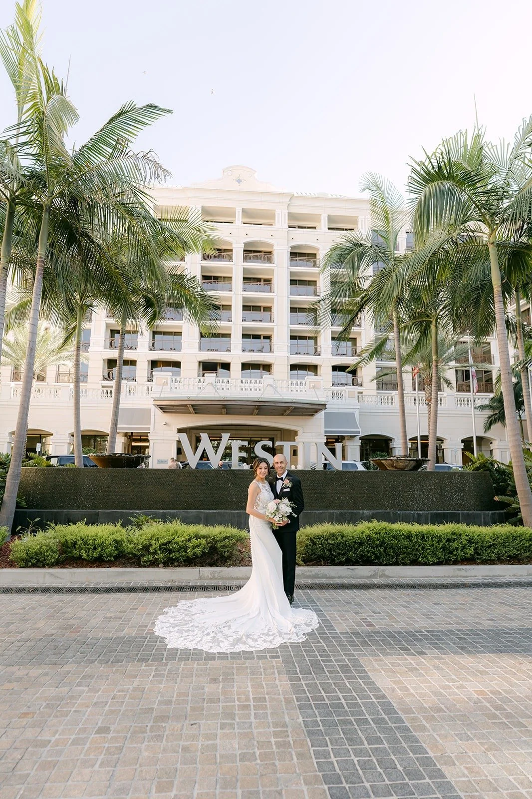 Francesca and Daniel in front of The Westin Anaheim Resort sign