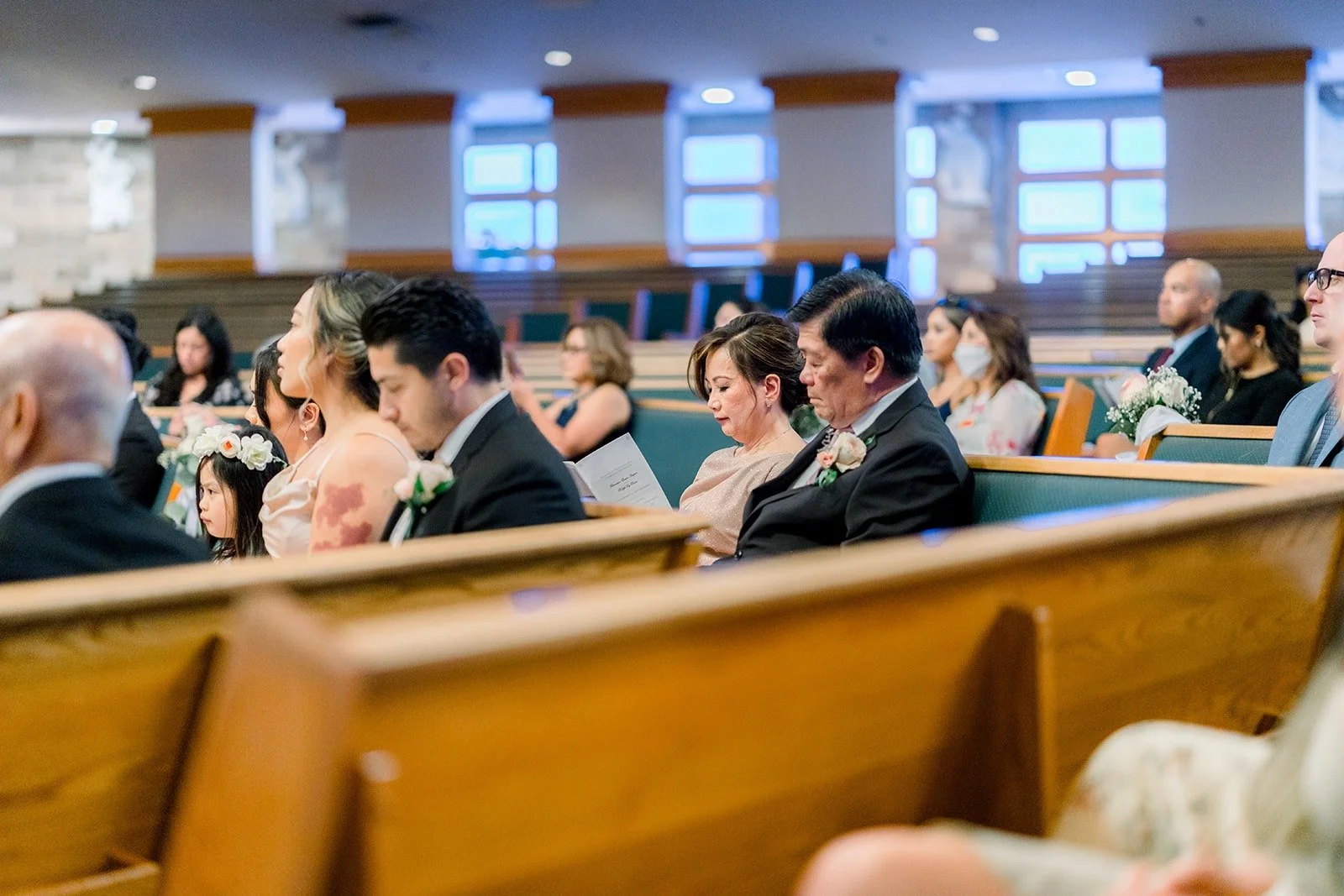 Guests in the pews watching the ceremony