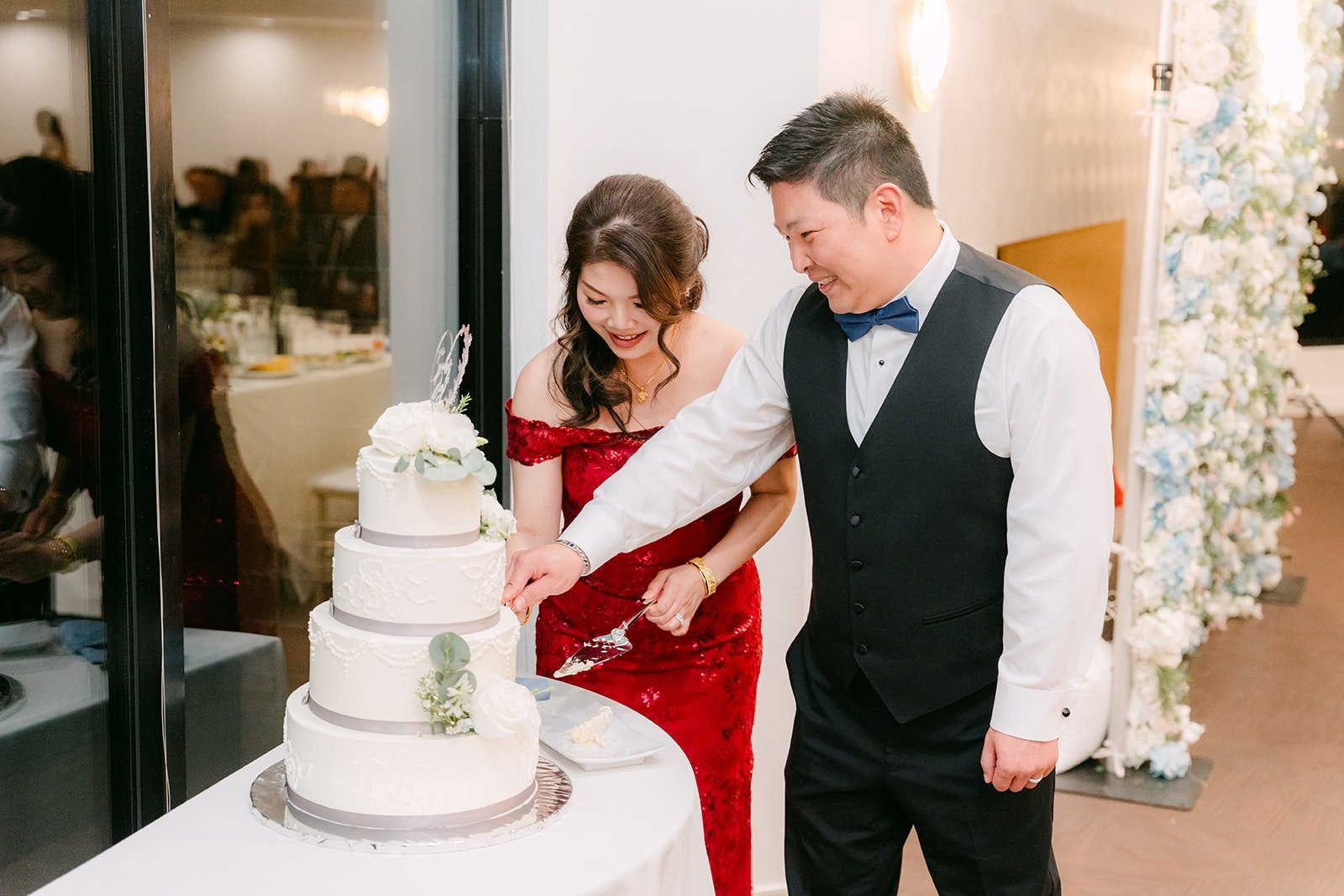 Sochi and Jay cut their wedding cake