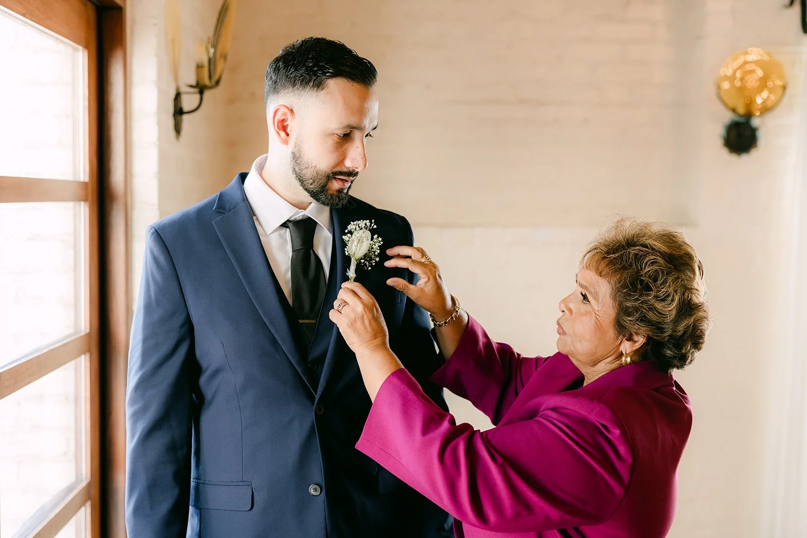 Danny's mom pinning on his boutonniere