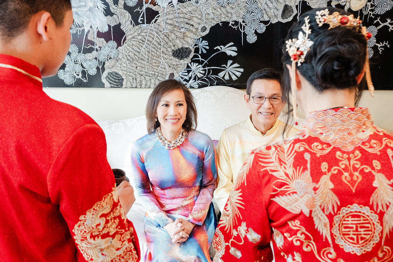 Bridgette and Henrik with family in ao dai during the tea ceremony.