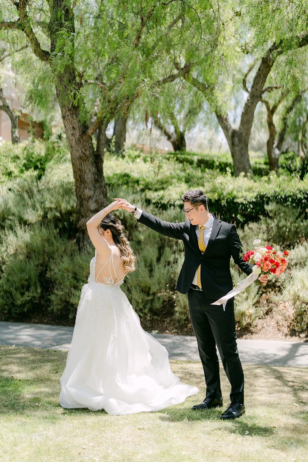 Zach twirling Joanne on the garden path at Rancho Bernardo Inn