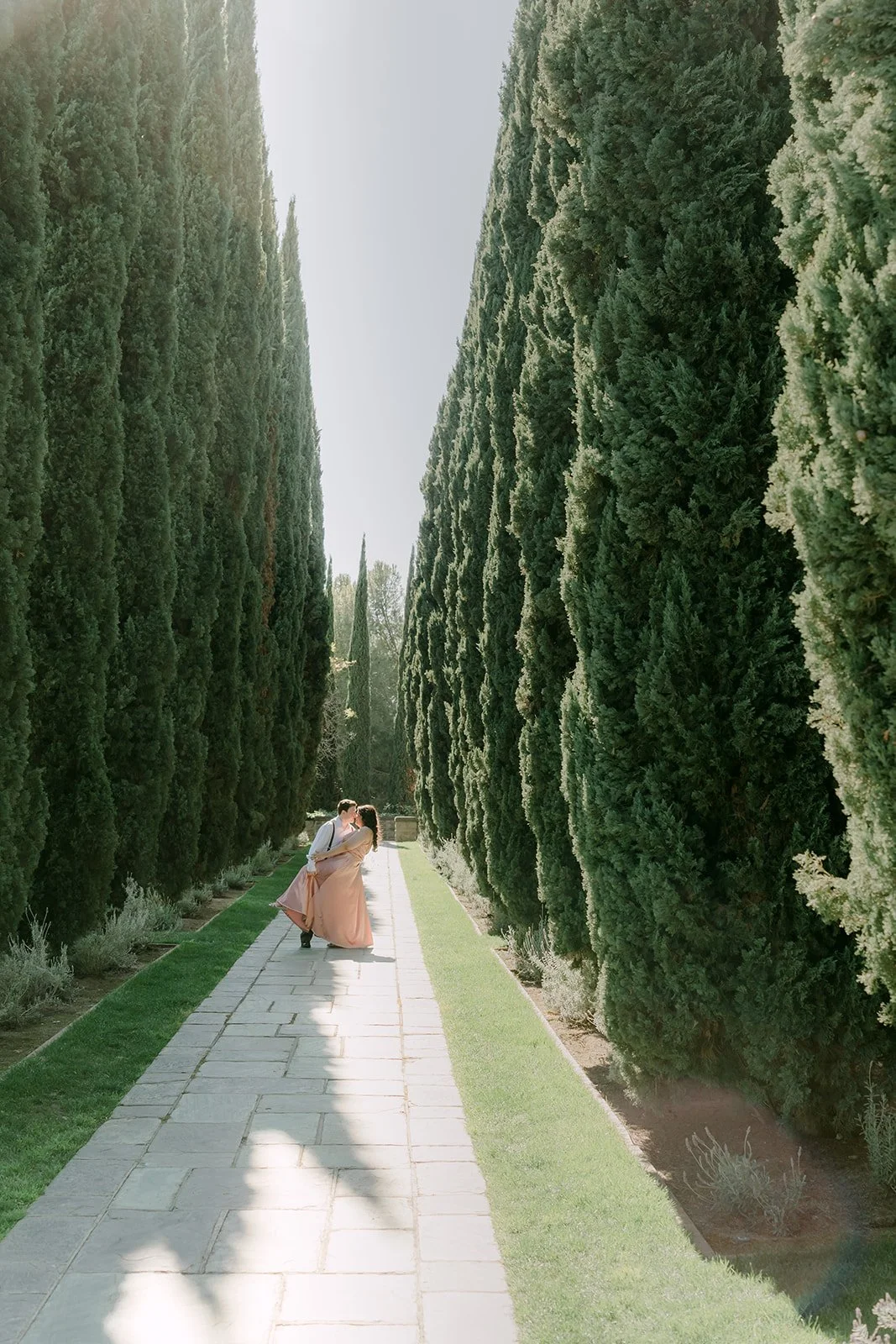 Long view down the cypress allée at Greystone with the couple in the distance.