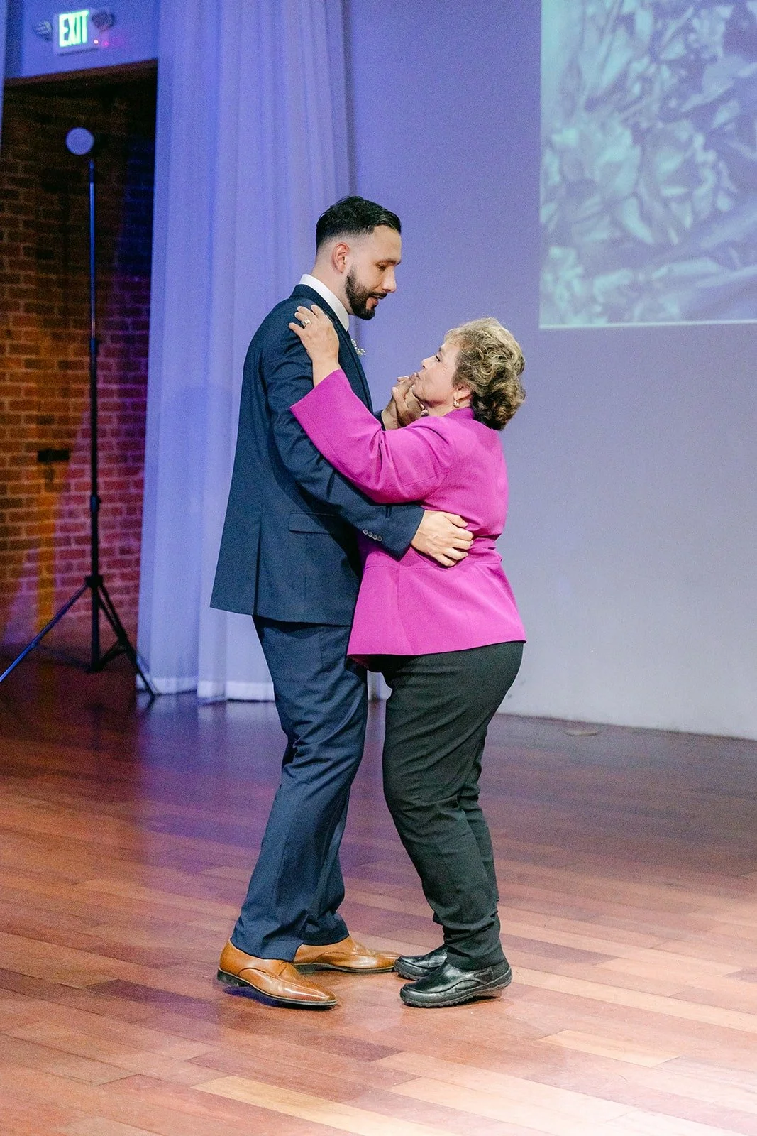 Danny and a family member dancing in the ballroom