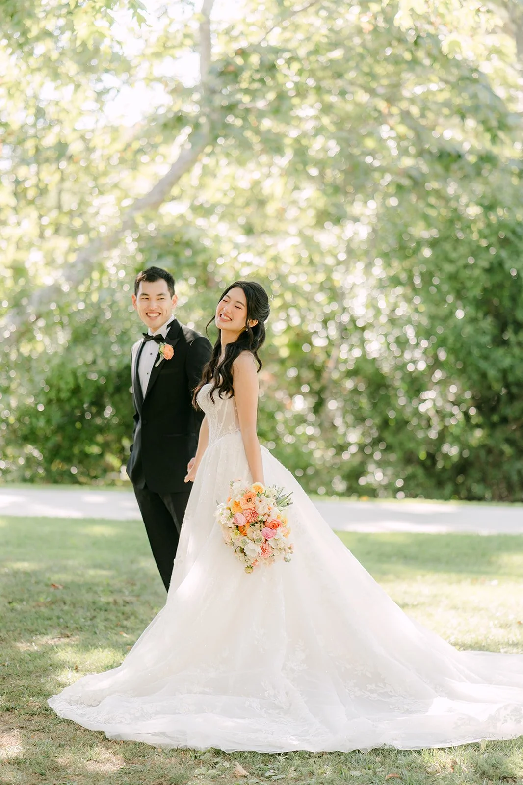 Clarissa and Austin walking across the University Club lawn