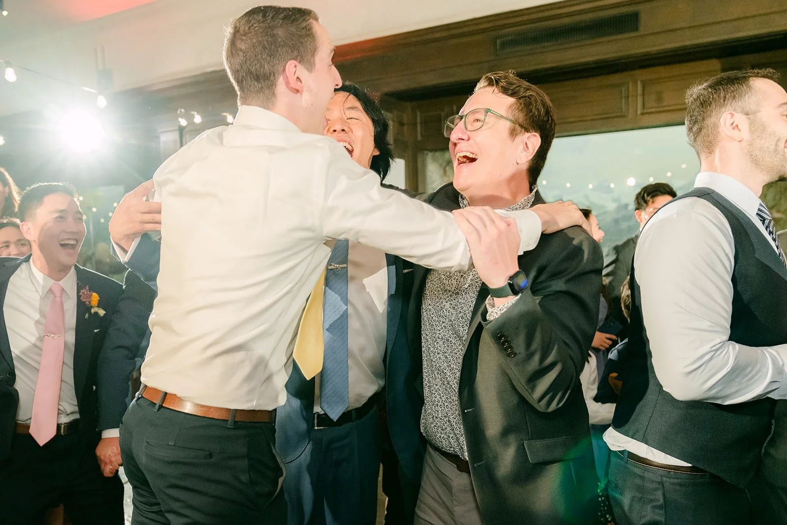Guests dancing arm in arm