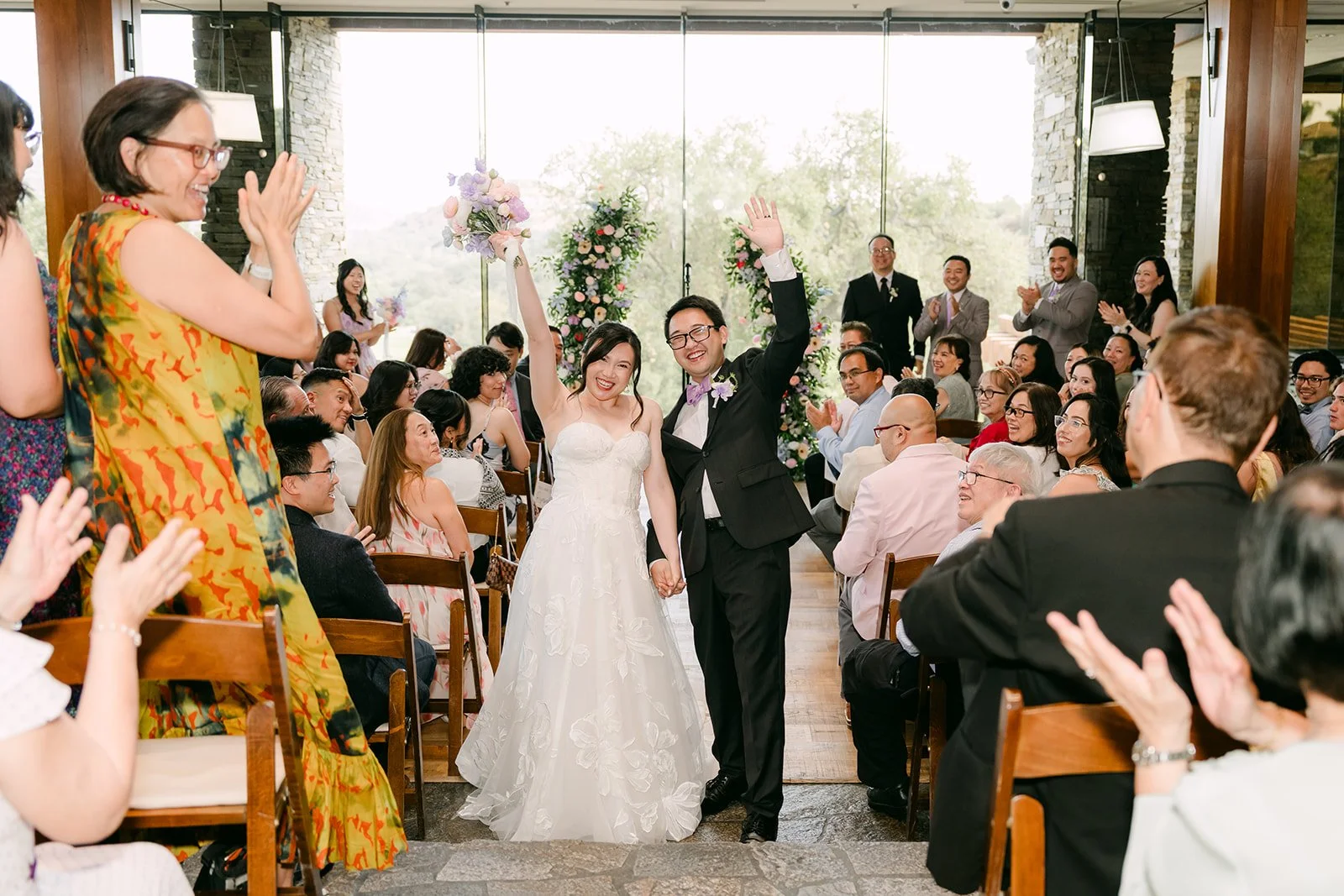Mary and Patrick celebrating down the aisle