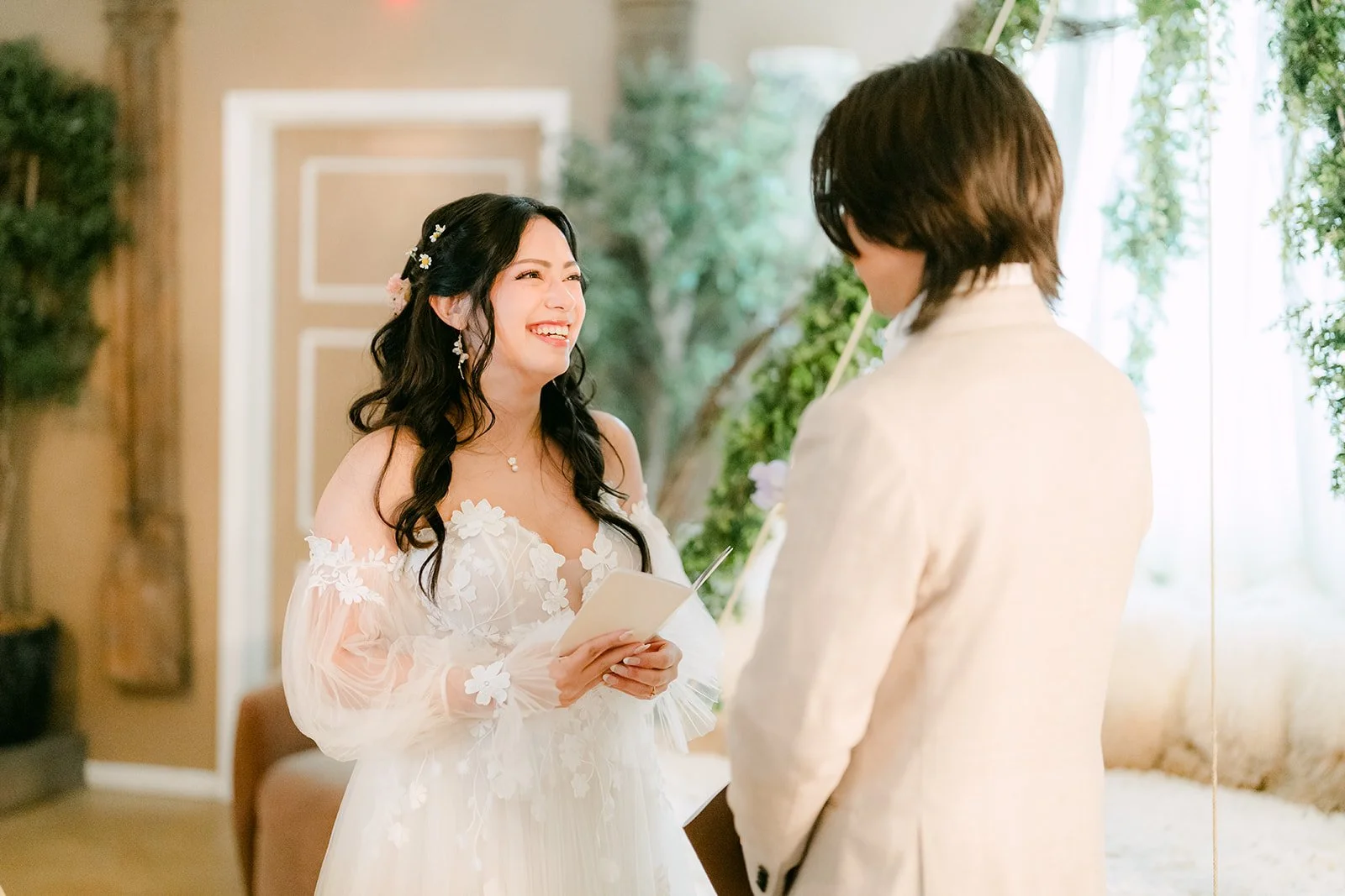 Bride holding back tears during their private vow exchange