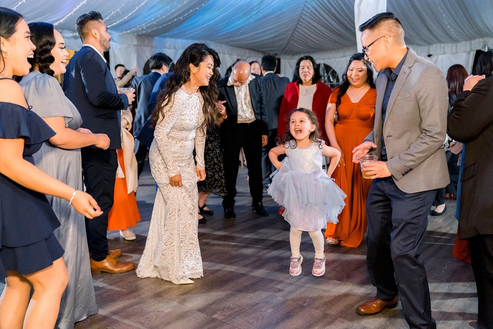 Guests dancing in the reception tent