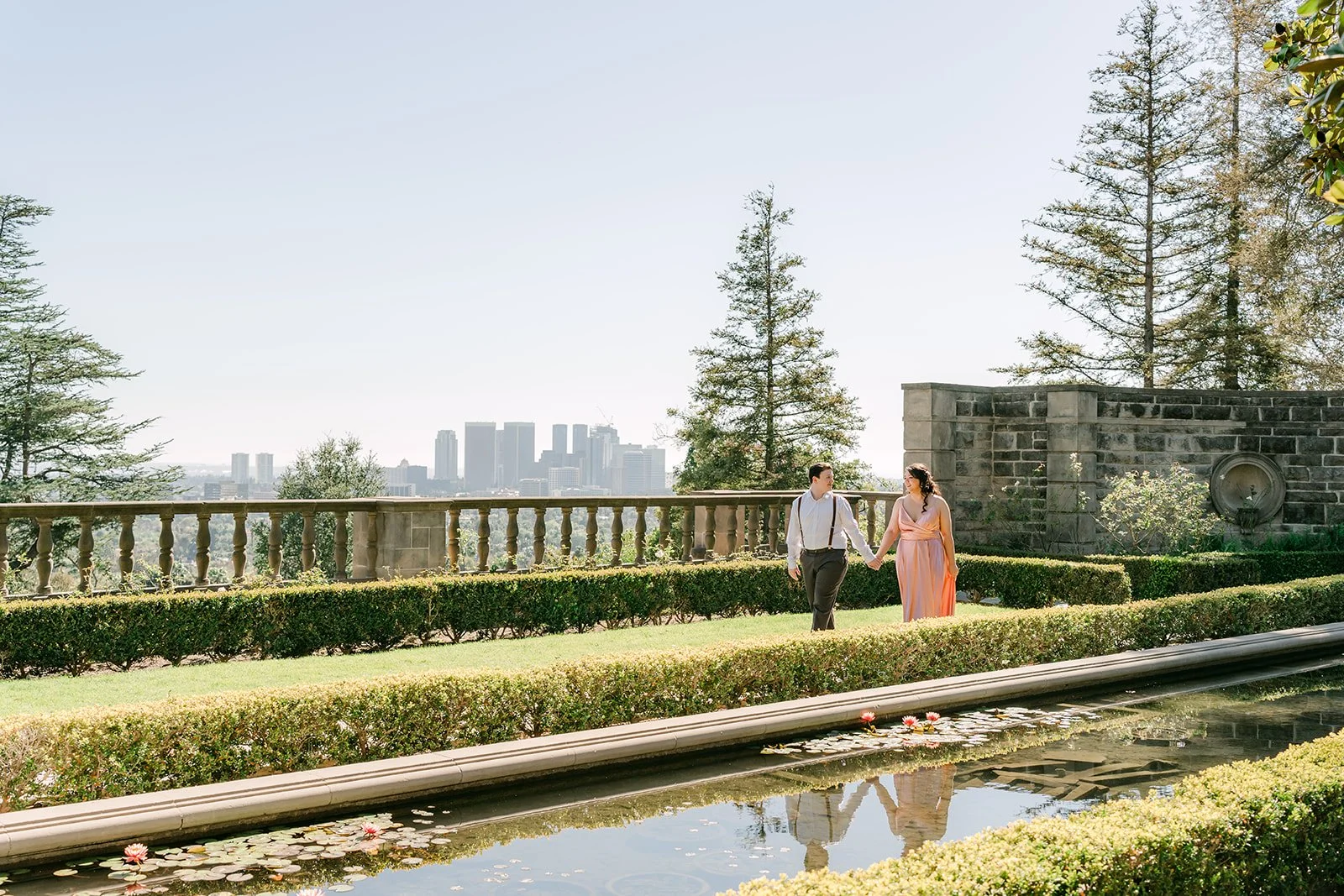 Saira and Matthew on the garden terrace with the Los Angeles skyline beyond.