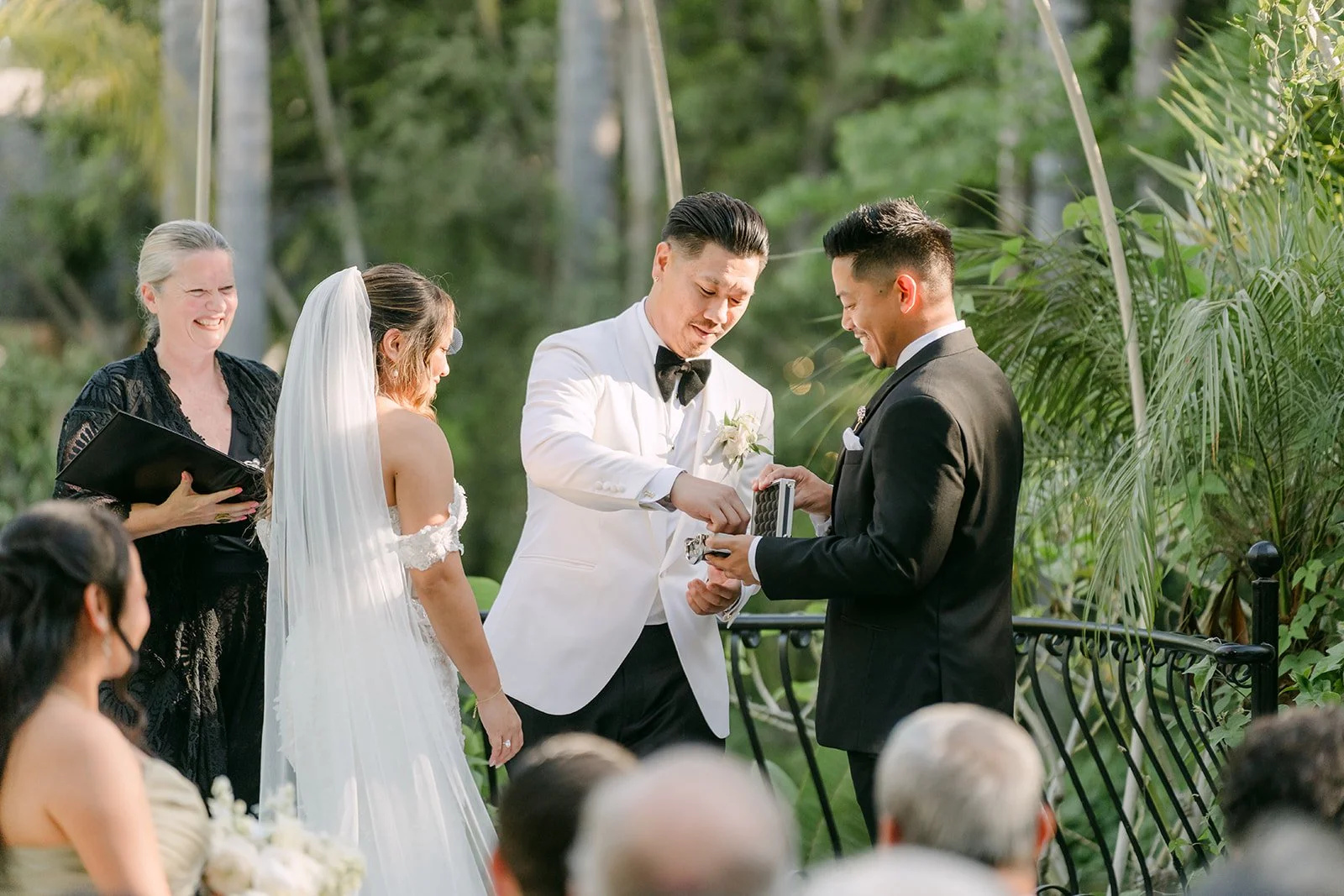 Caryl and Nicole exchanging rings during their ceremony.