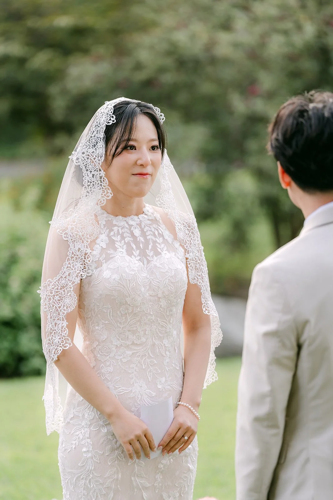 Elaine smiling as she listens at the altar.