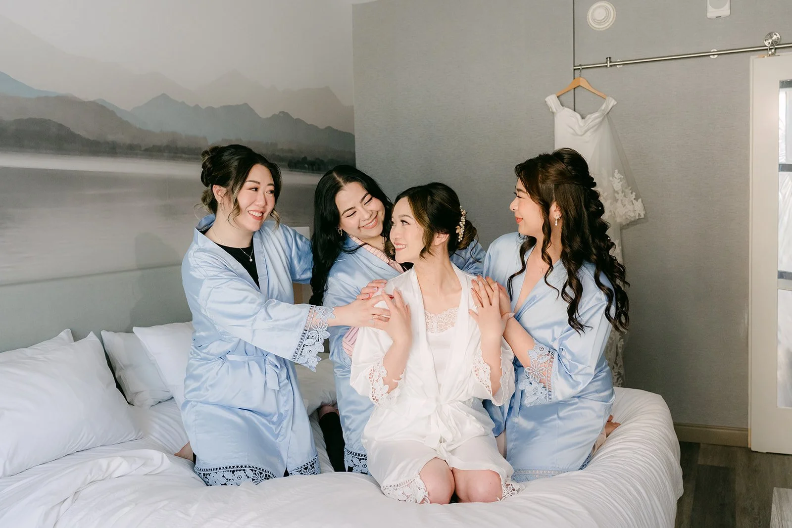 Amanda and her bridesmaids relaxing in matching blue robes.