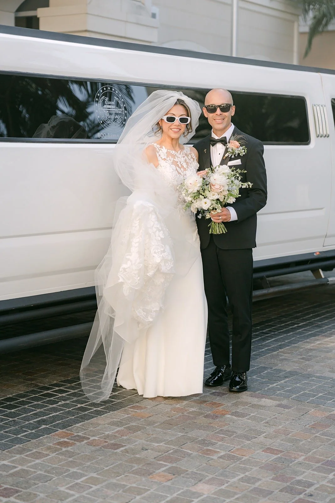 Francesca and a family member beside the white limousine