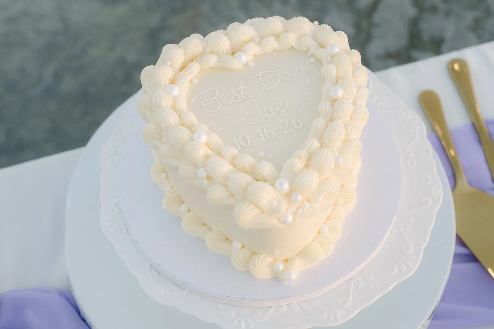 Heart-shaped white wedding cake.