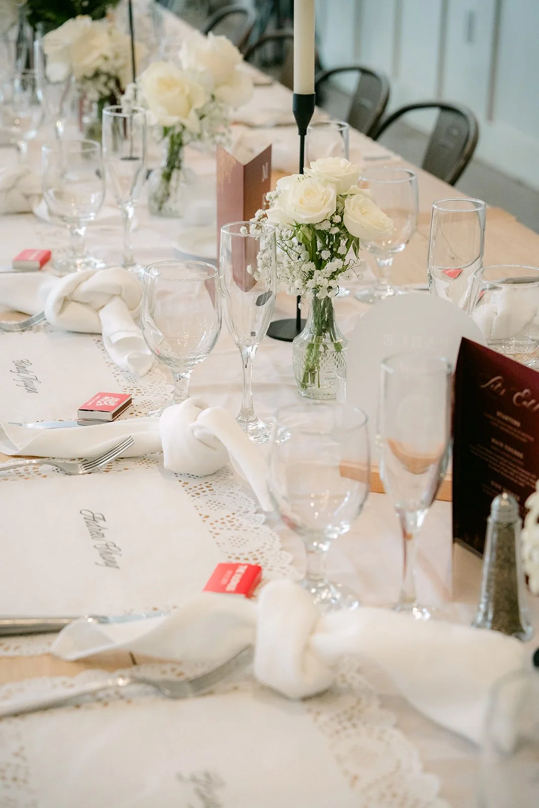 Table setting with white florals and glassware