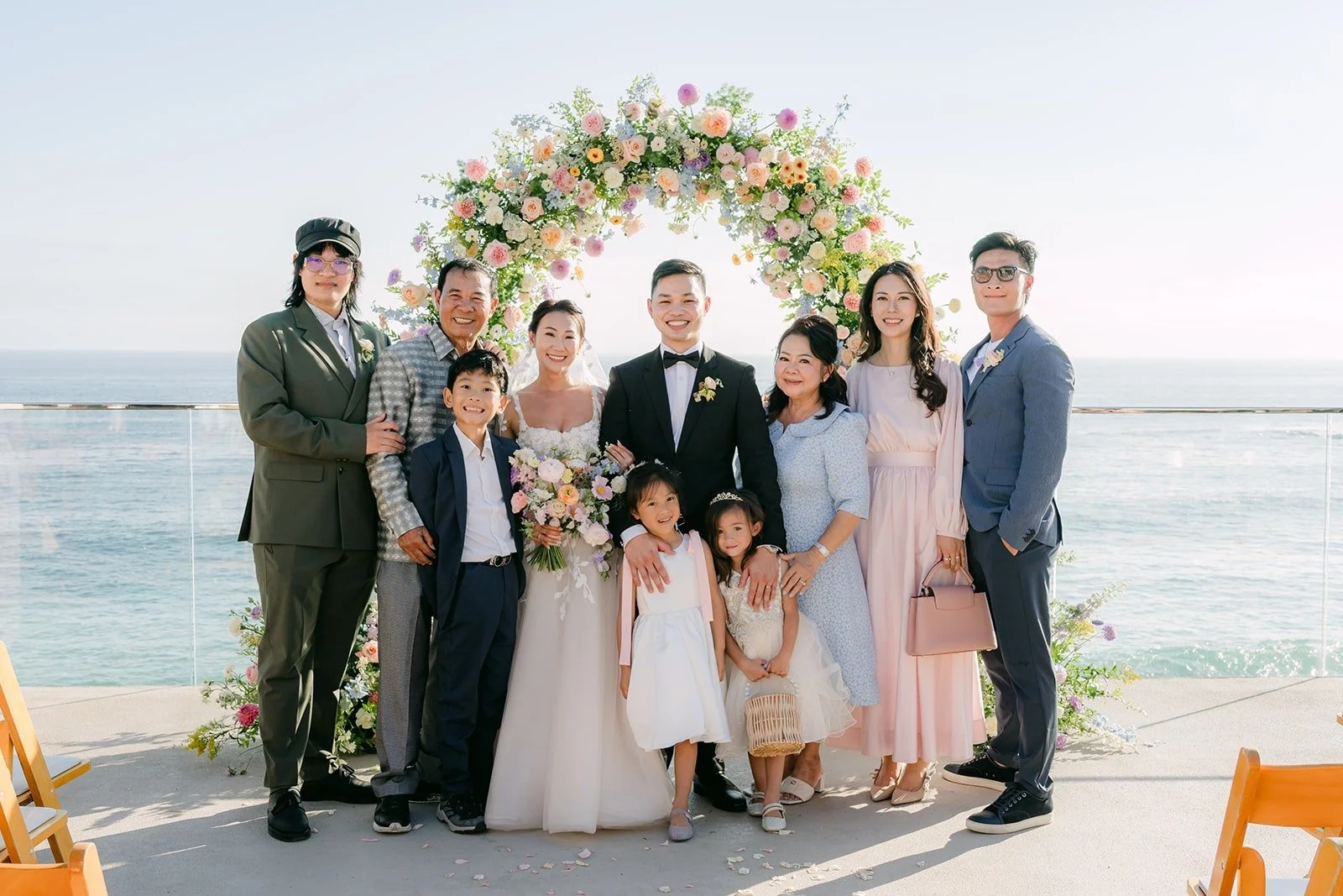 Kylie and Mario with family and friends in front of the arch and the Pacific