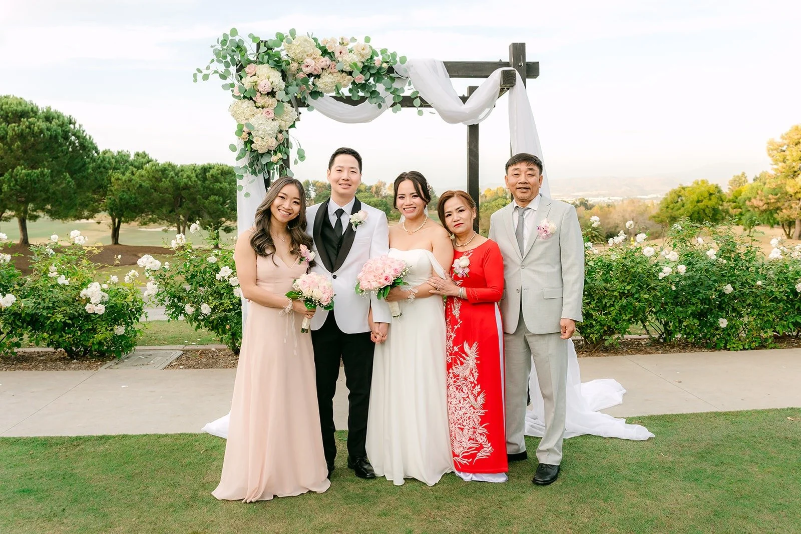 Ivy and Chungman with family on the ceremony lawn