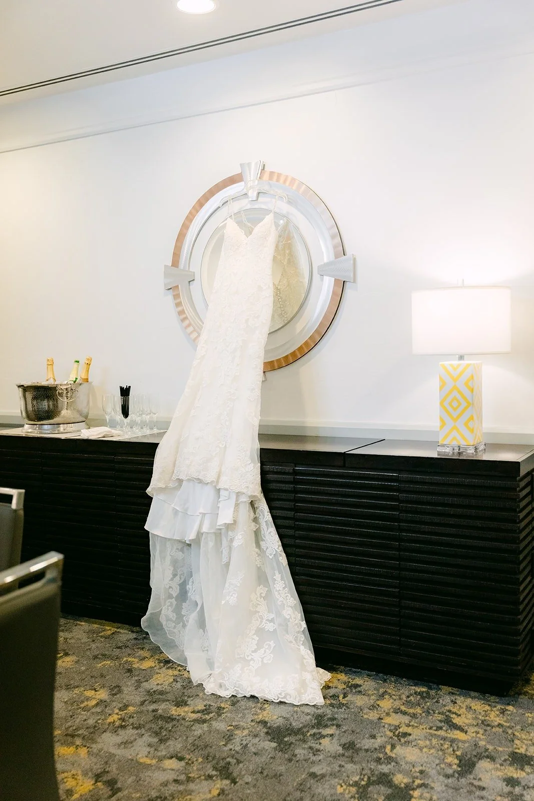Xuemin's lace mermaid gown hanging in the bridal suite at the Turnip Rose
