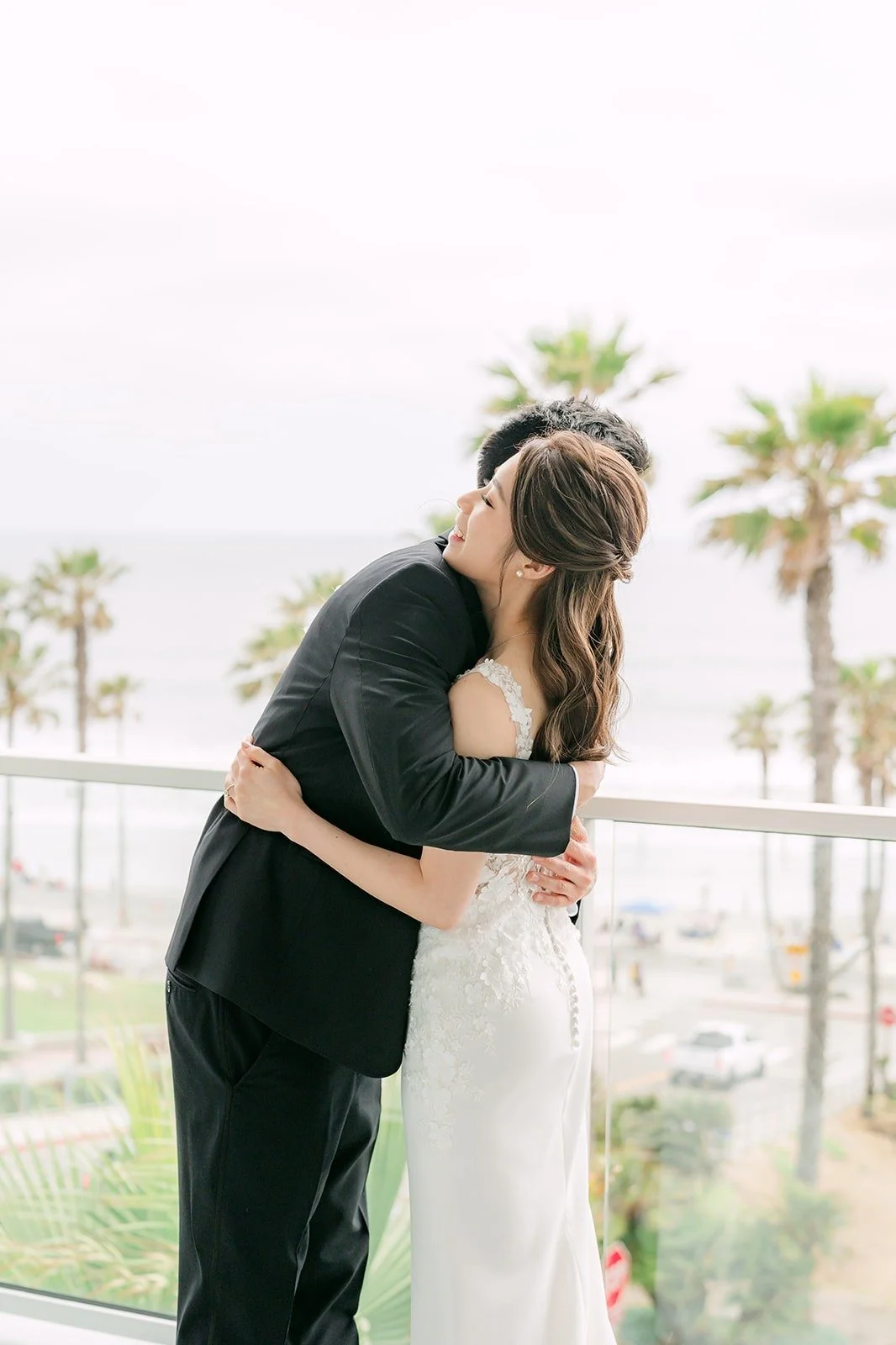 Angela and Eli hugging tight after their first look
