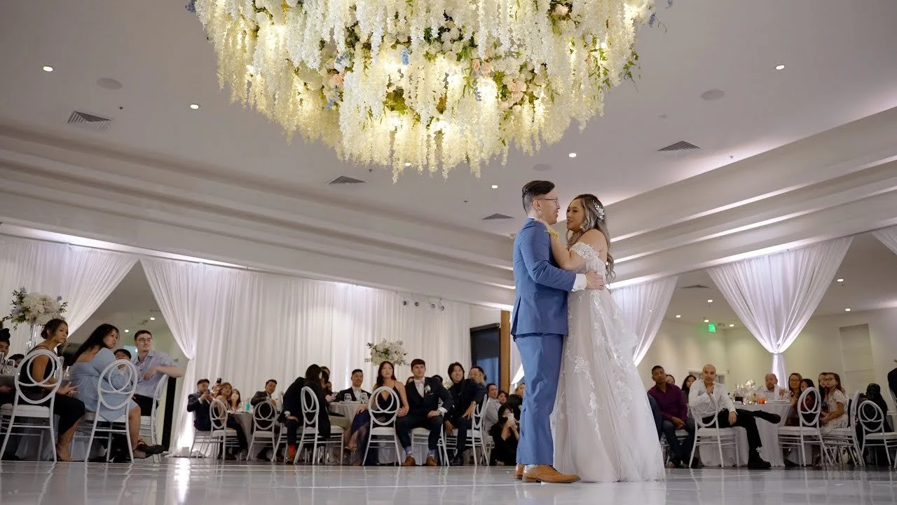 Video still of the first dance under the crystal chandelier, filmed by One and Only Production