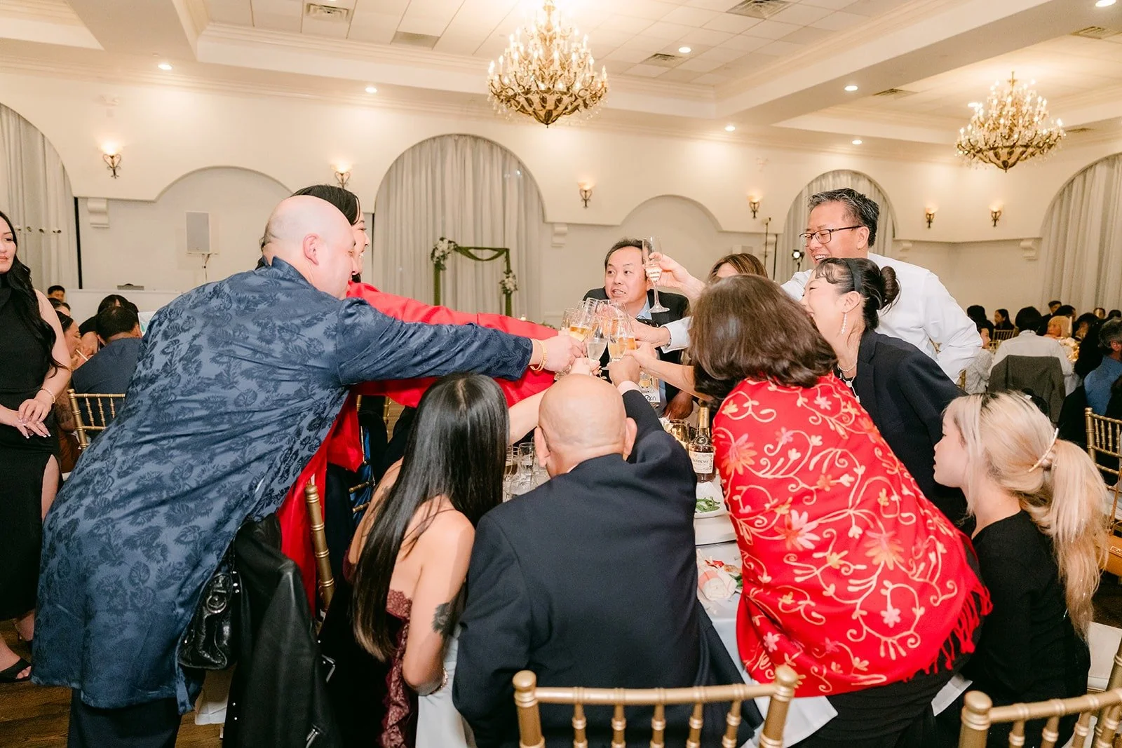 A table of guests posing during table visits