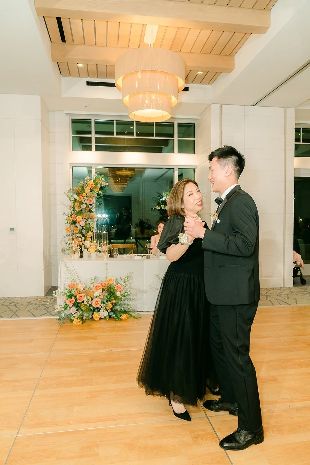 Eli sharing a parent dance on the ballroom floor, photographed by One and Only Production
