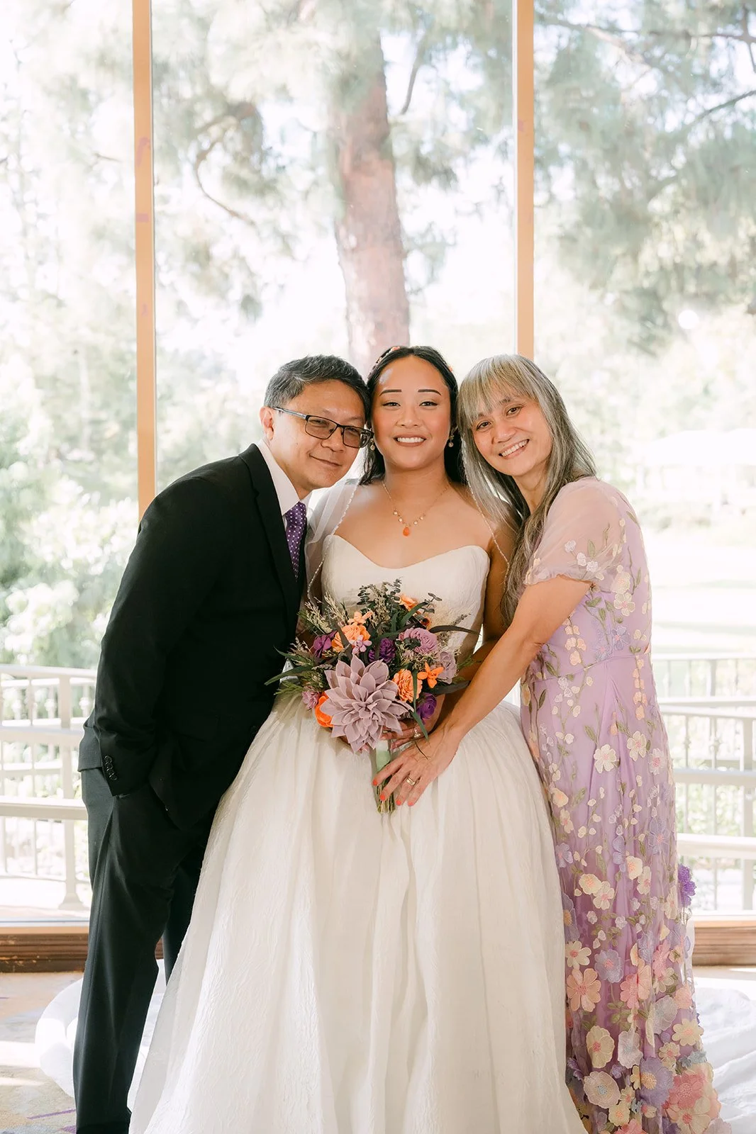 Angela's dad kissing her cheek