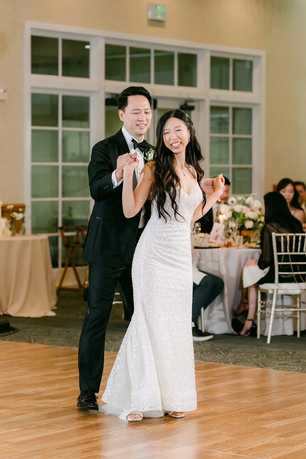 Kristine smiling up at William during their first dance