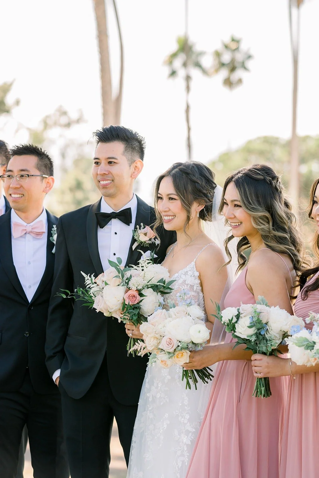Josephine and David laughing with members of the wedding party