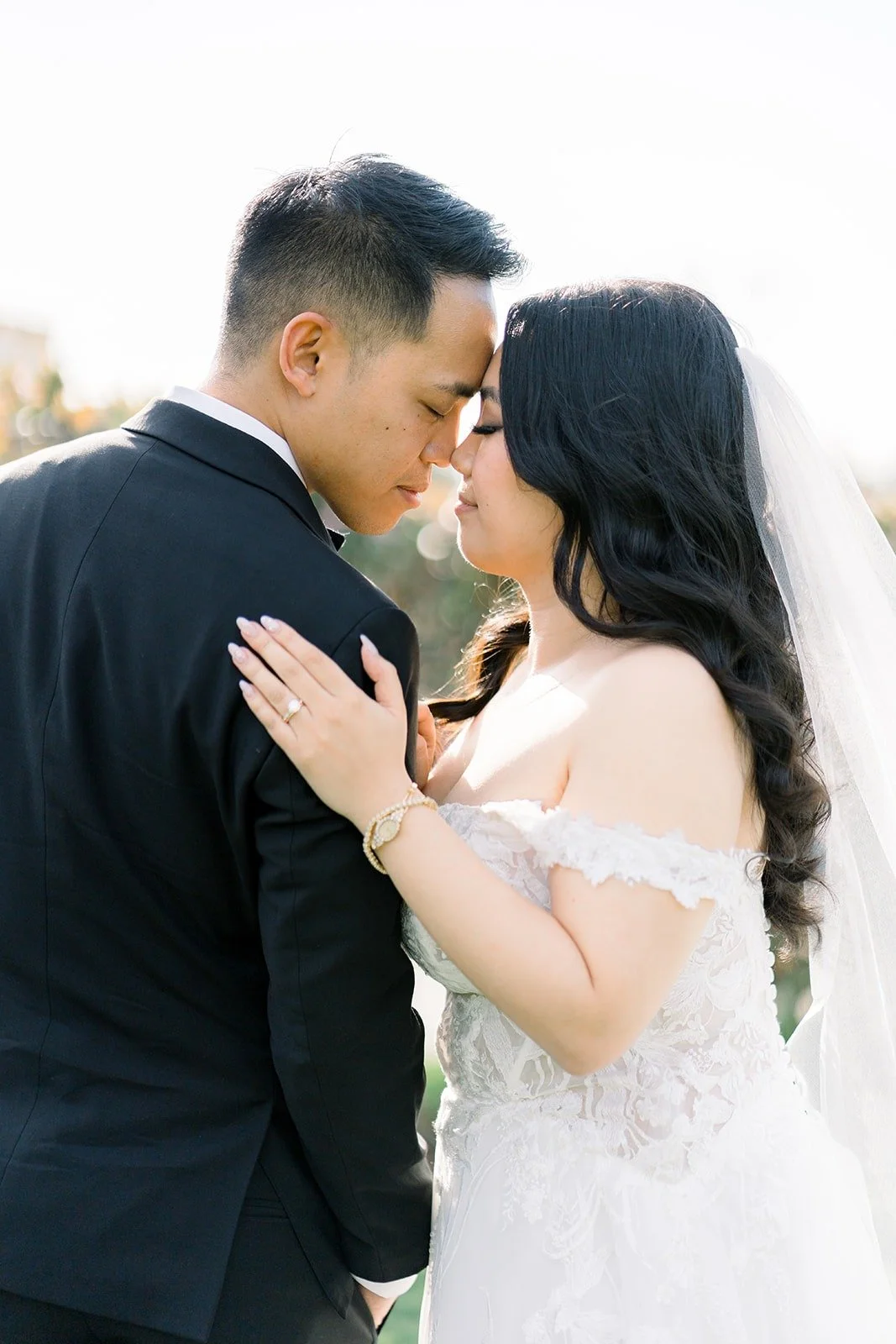 Francesca resting her hand on Ralph's chest as they lean in close