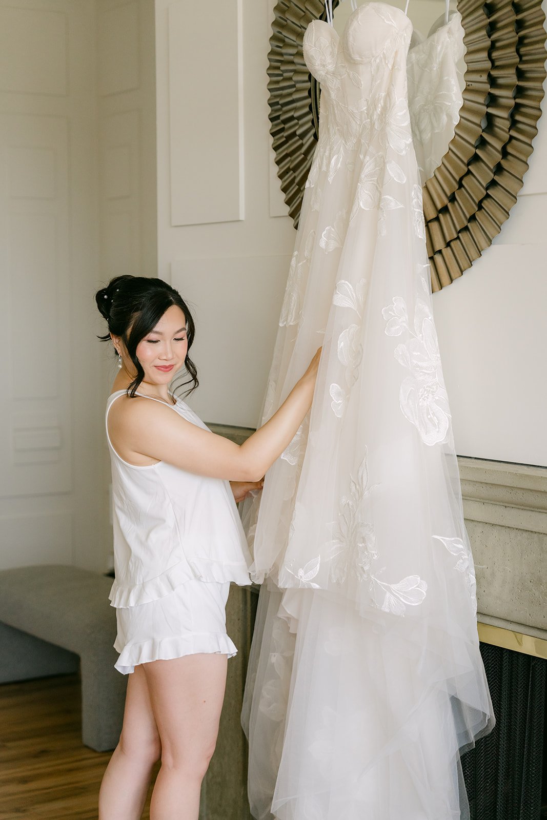Mary reaching for her wedding gown