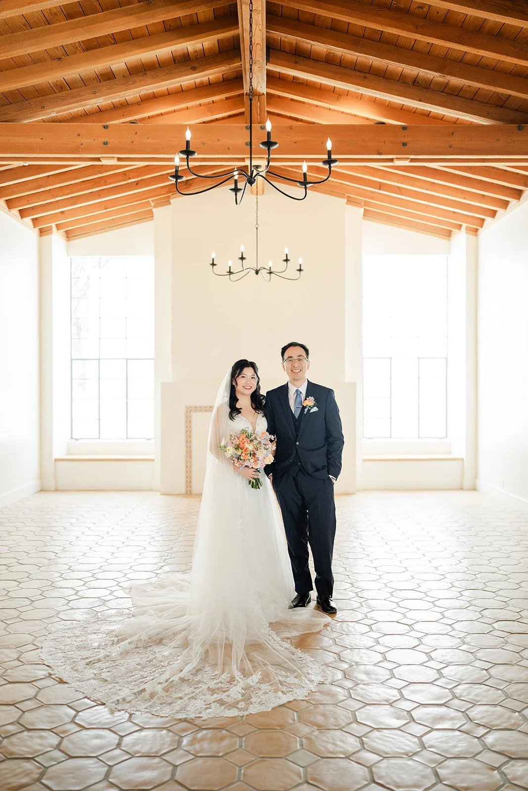 Couple in the reception hall with the train spread across the floor