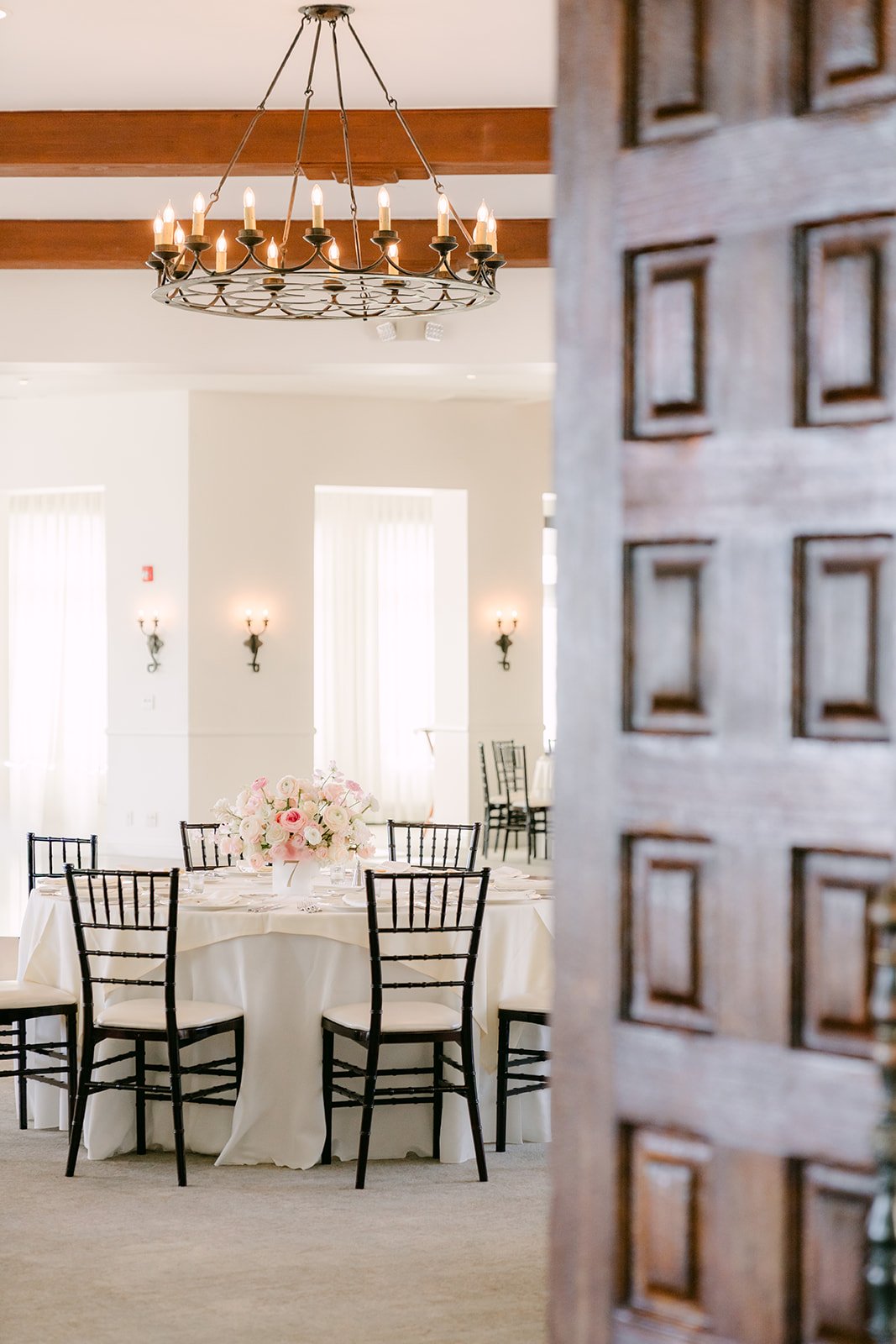 Reception room seen through the carved wooden doors