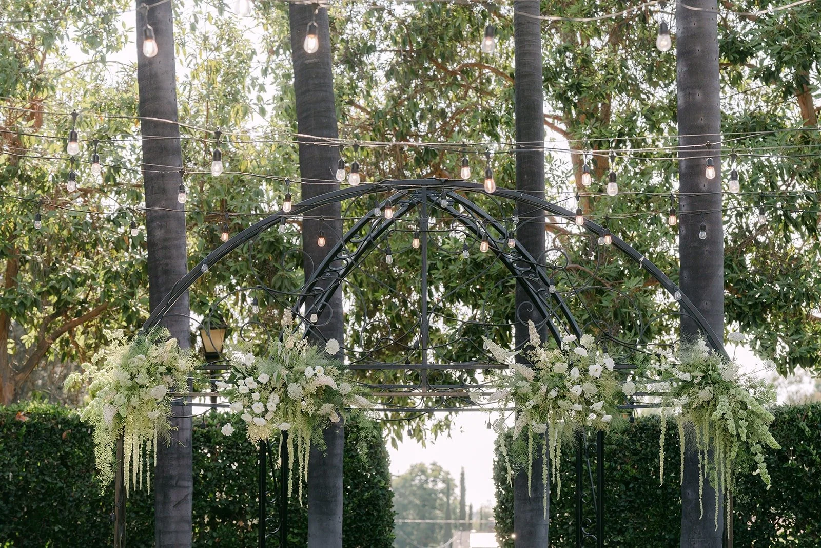 Greenery and white florals along the Italian Garden ceremony site