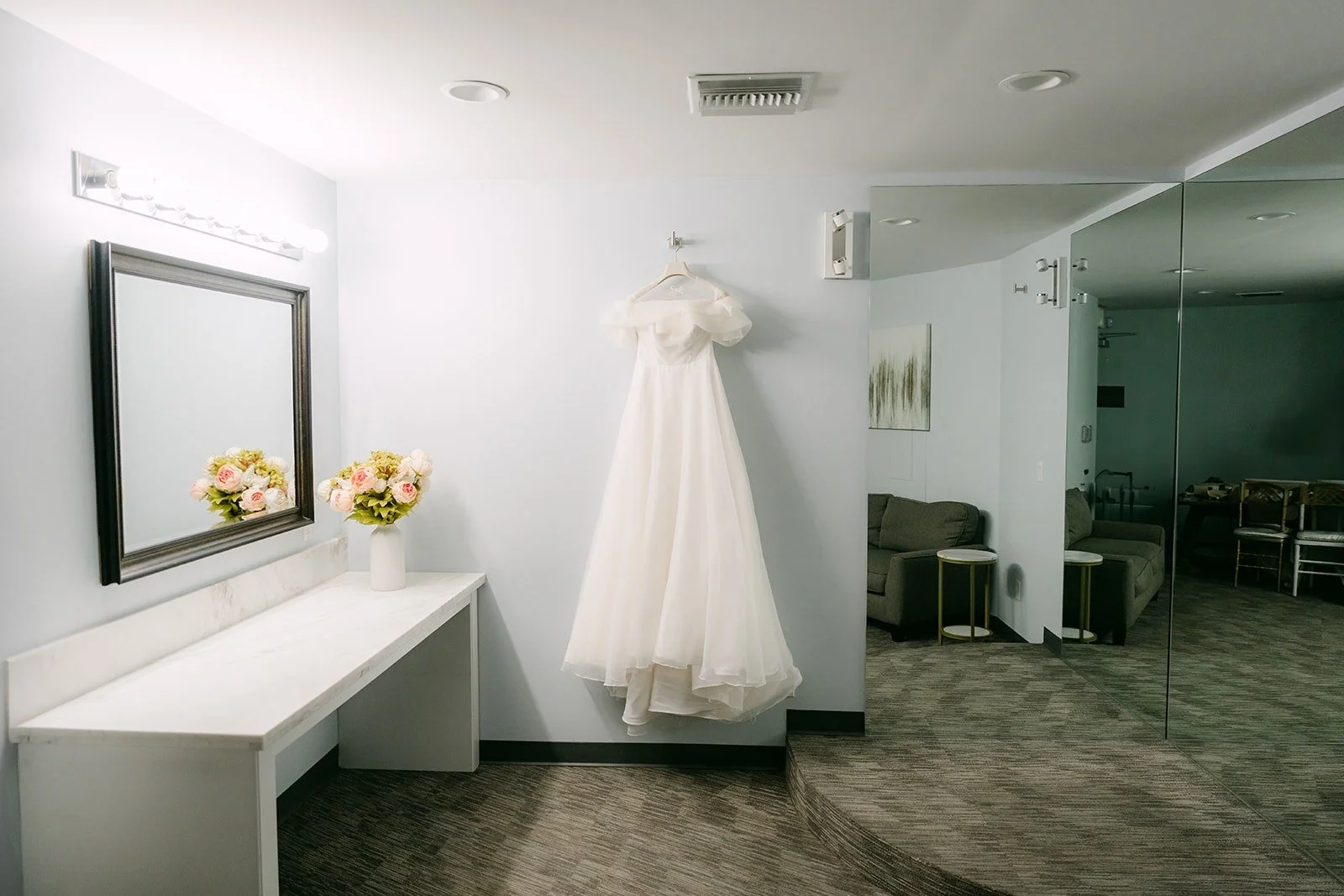 Jeannie's wedding gown hanging in the bridal suite at Skylinks Golf Course