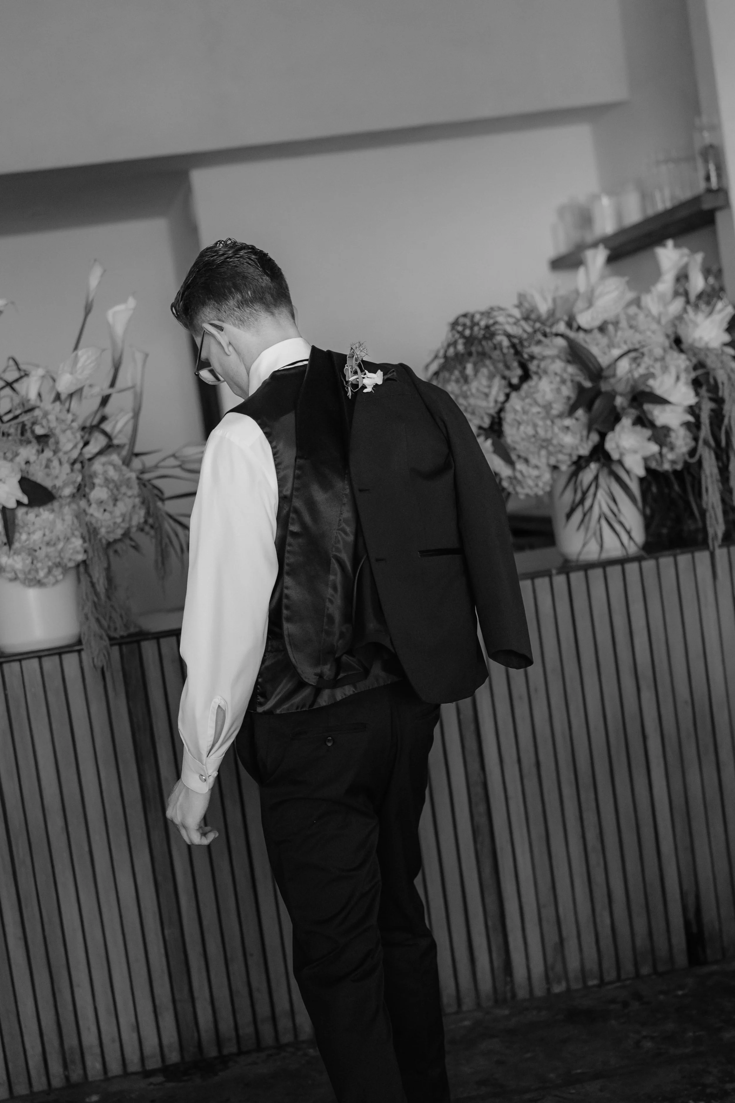 Black and white photo of the groom getting ready at Fig Tree in Venice