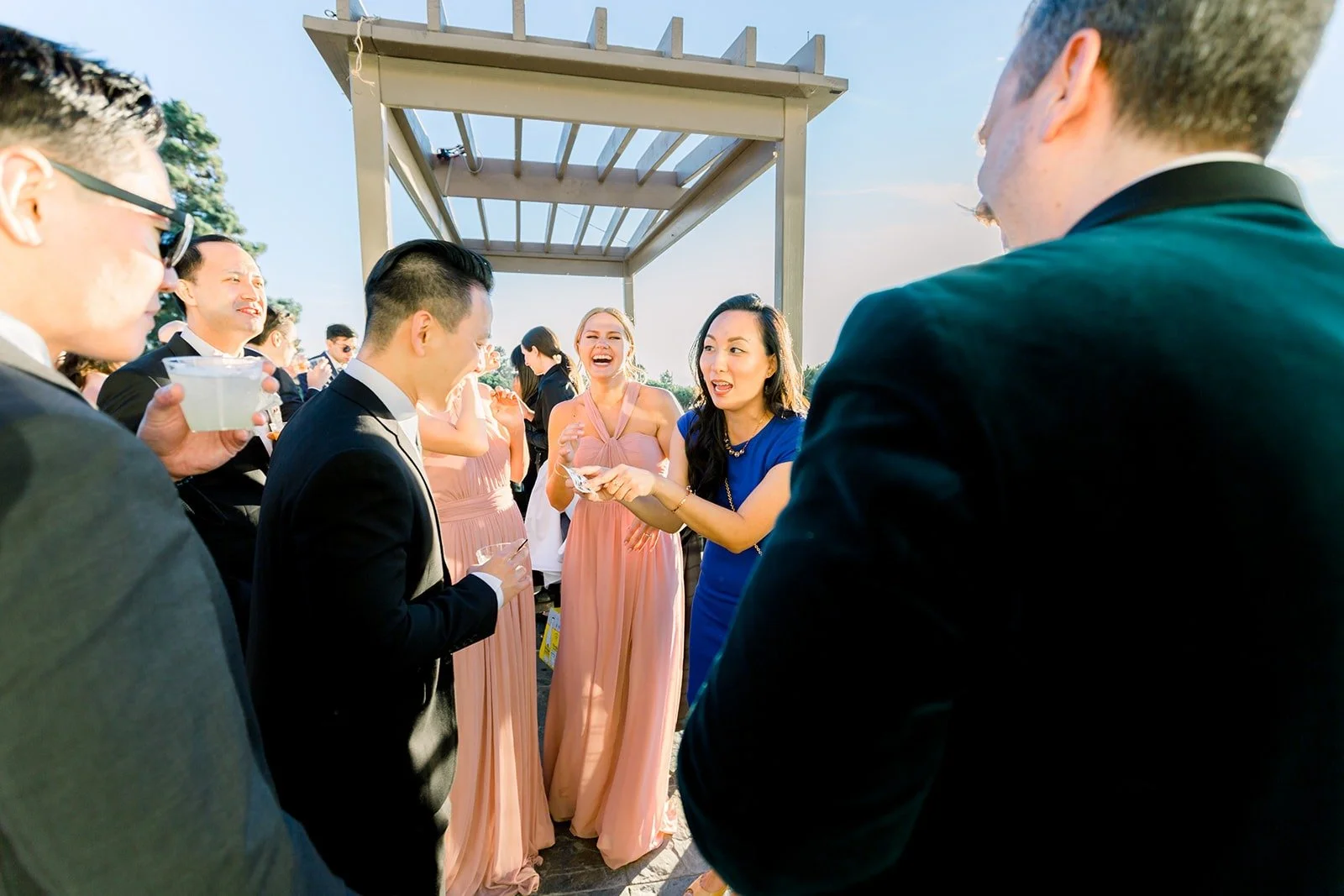 Guests mingling outside at Los Verdes Golf Course, photographed by One and Only Production