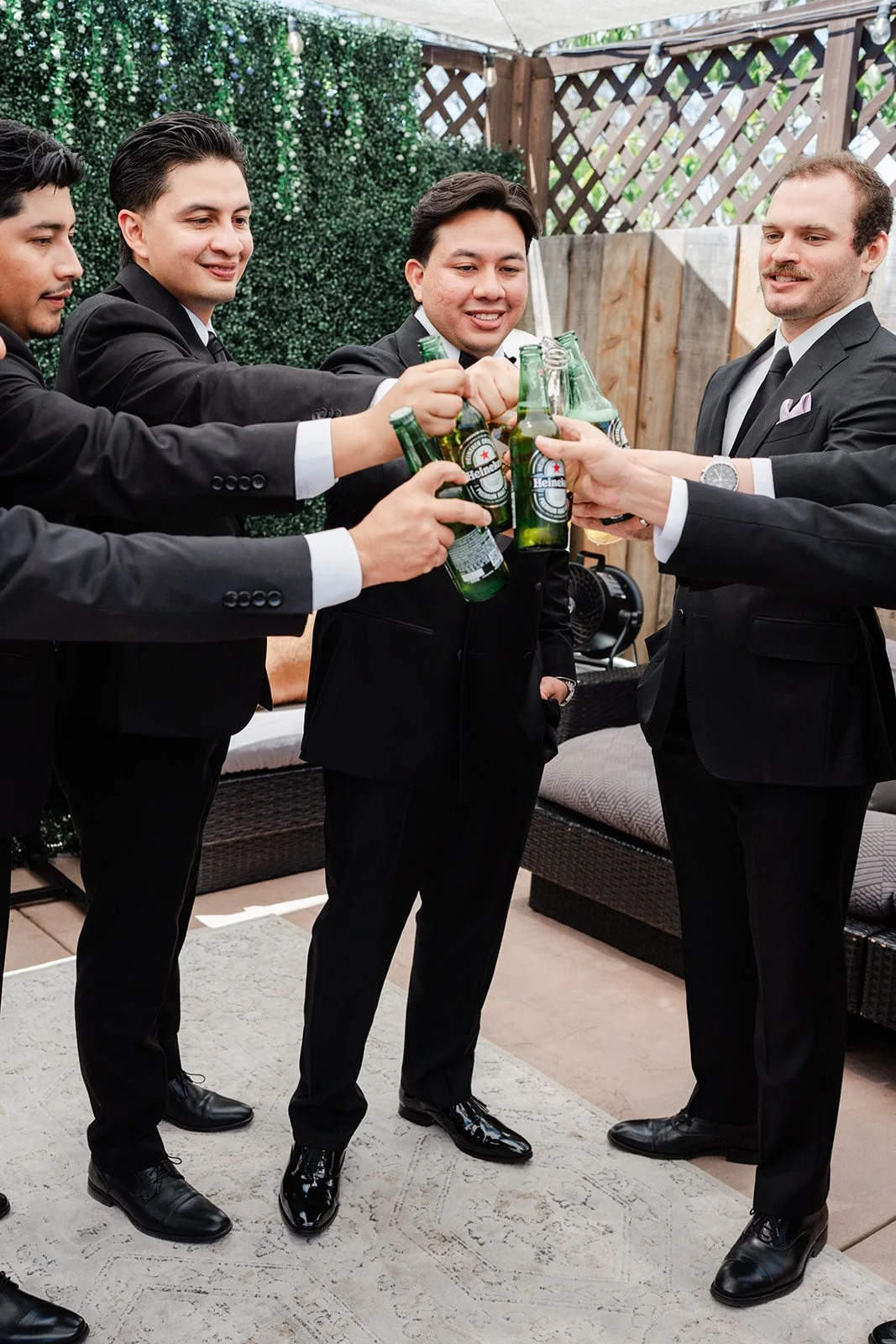 Groomsmen toasting with beers before the ceremony