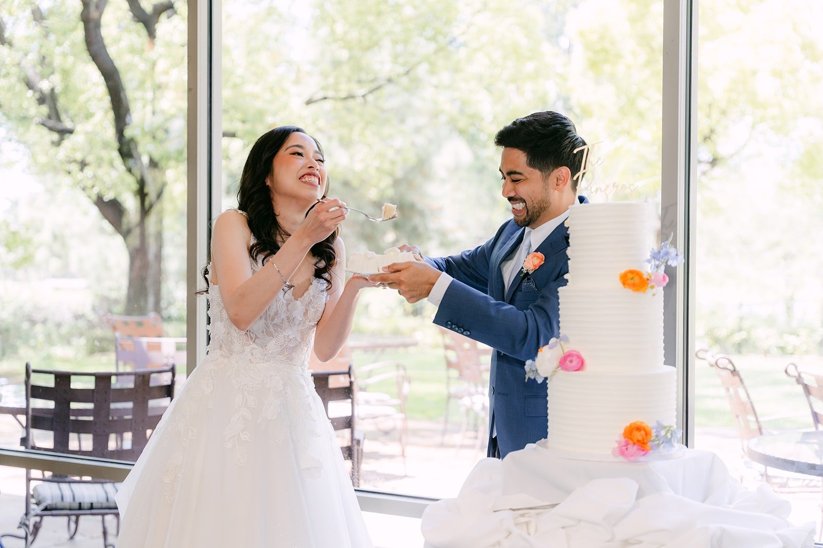 Mark feeding Natalie a bite of cake