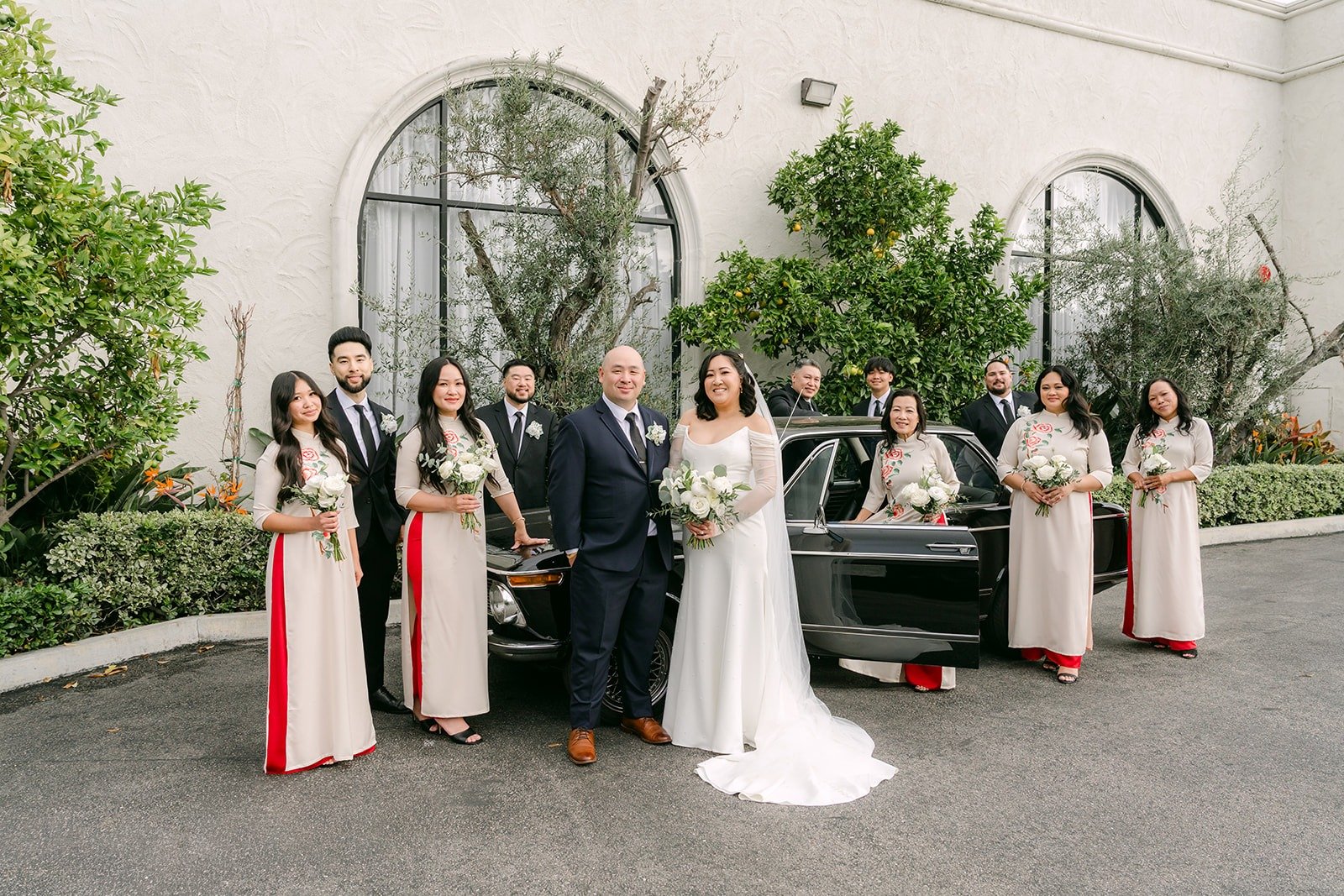 Vivian with her bridesmaids in ivory and red