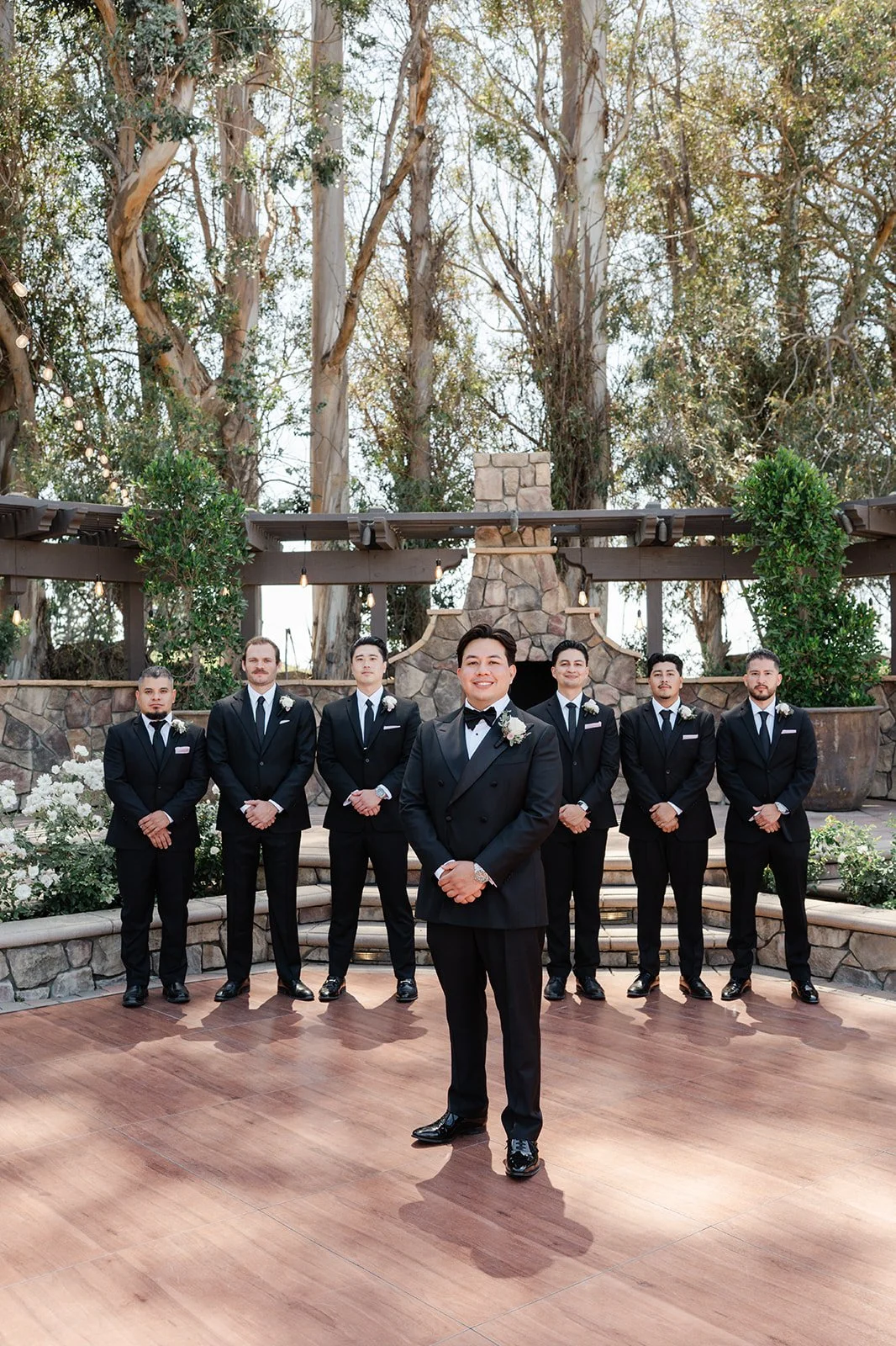 Groom and groomsmen on the reception patio at The Walnut Grove