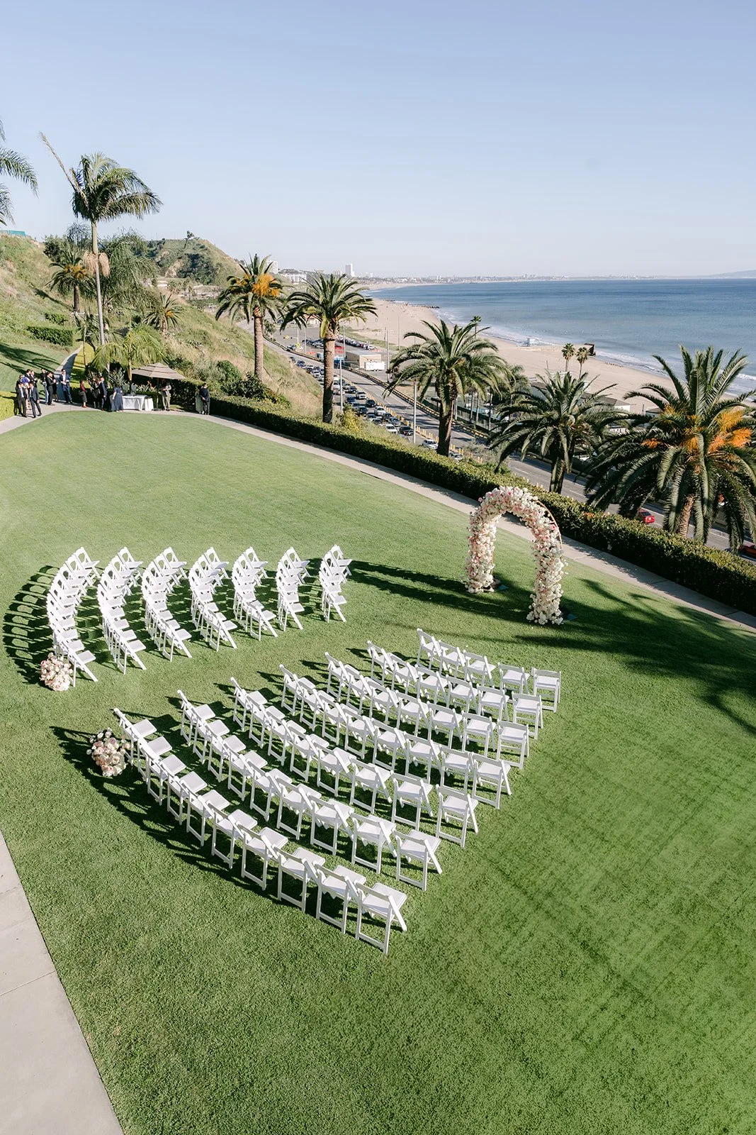 Overhead view of the ceremony lawn and the coastline below