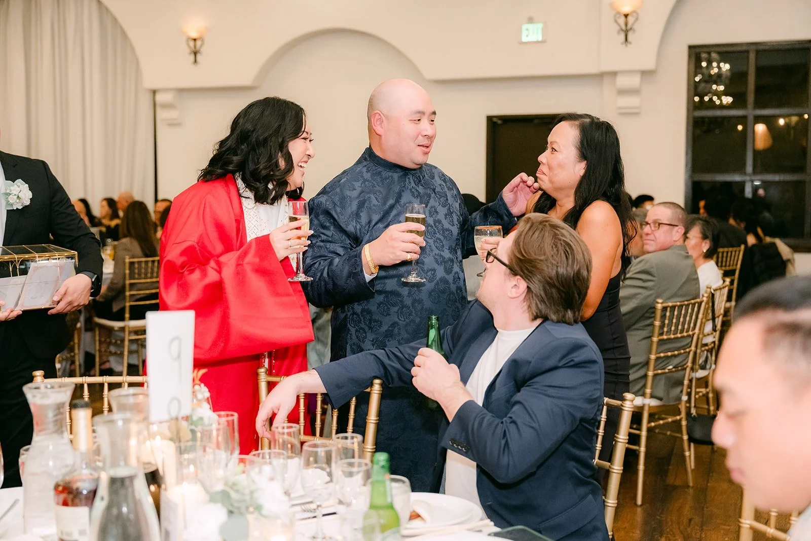Vivian and Yao visiting a table of guests
