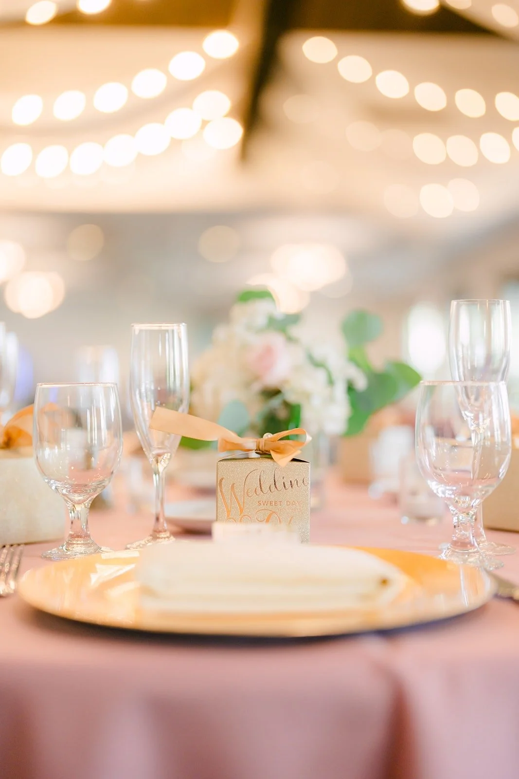 Place setting glowing under the ballroom lights
