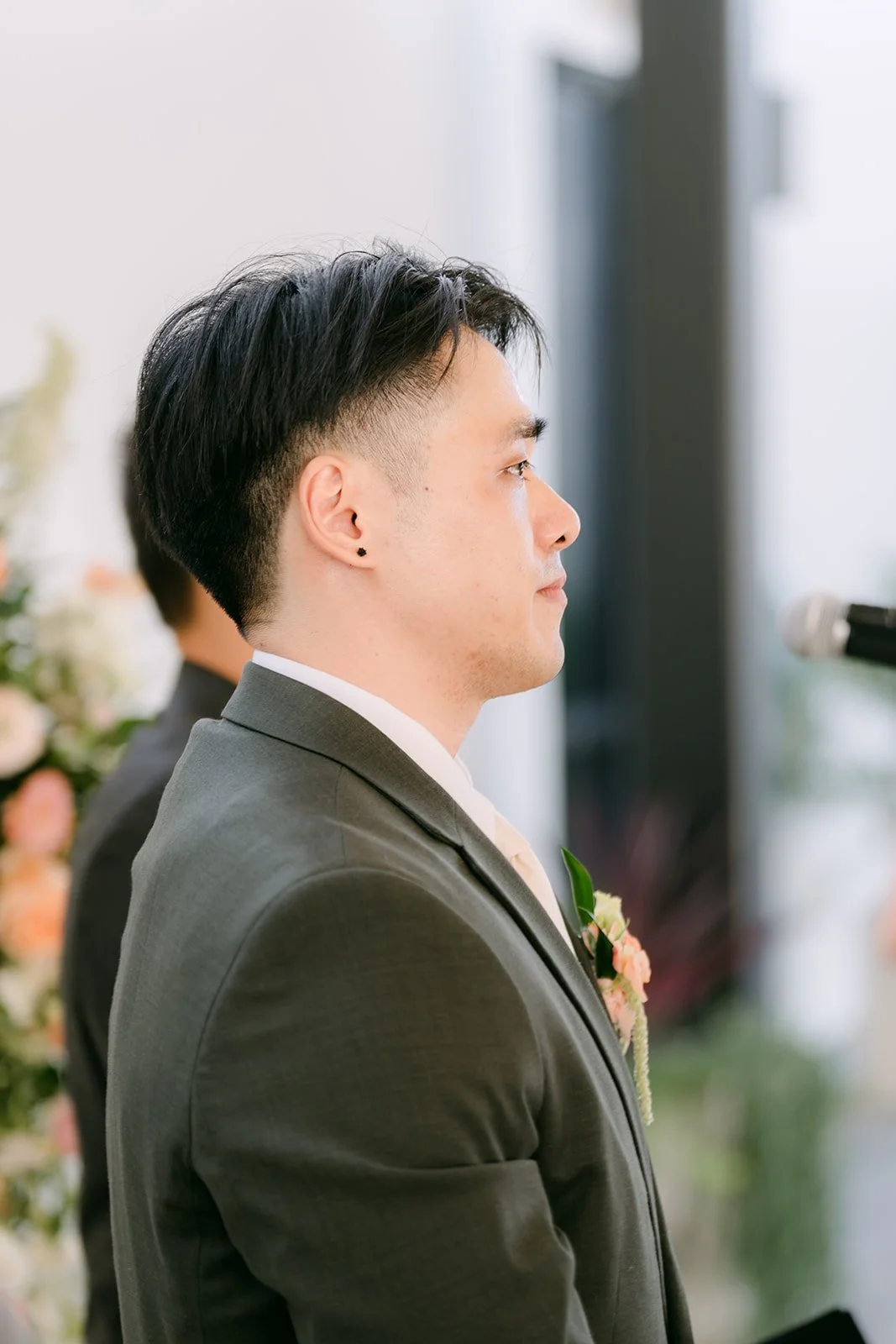 Alex watching as Vivian comes down the aisle